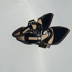 Black and gold leather heels